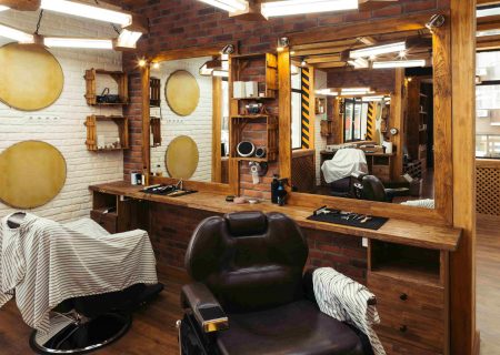 empty-chairs-reflected-in-mirrors-in-modern-barber-HXZ73RQ-scaled.jpg